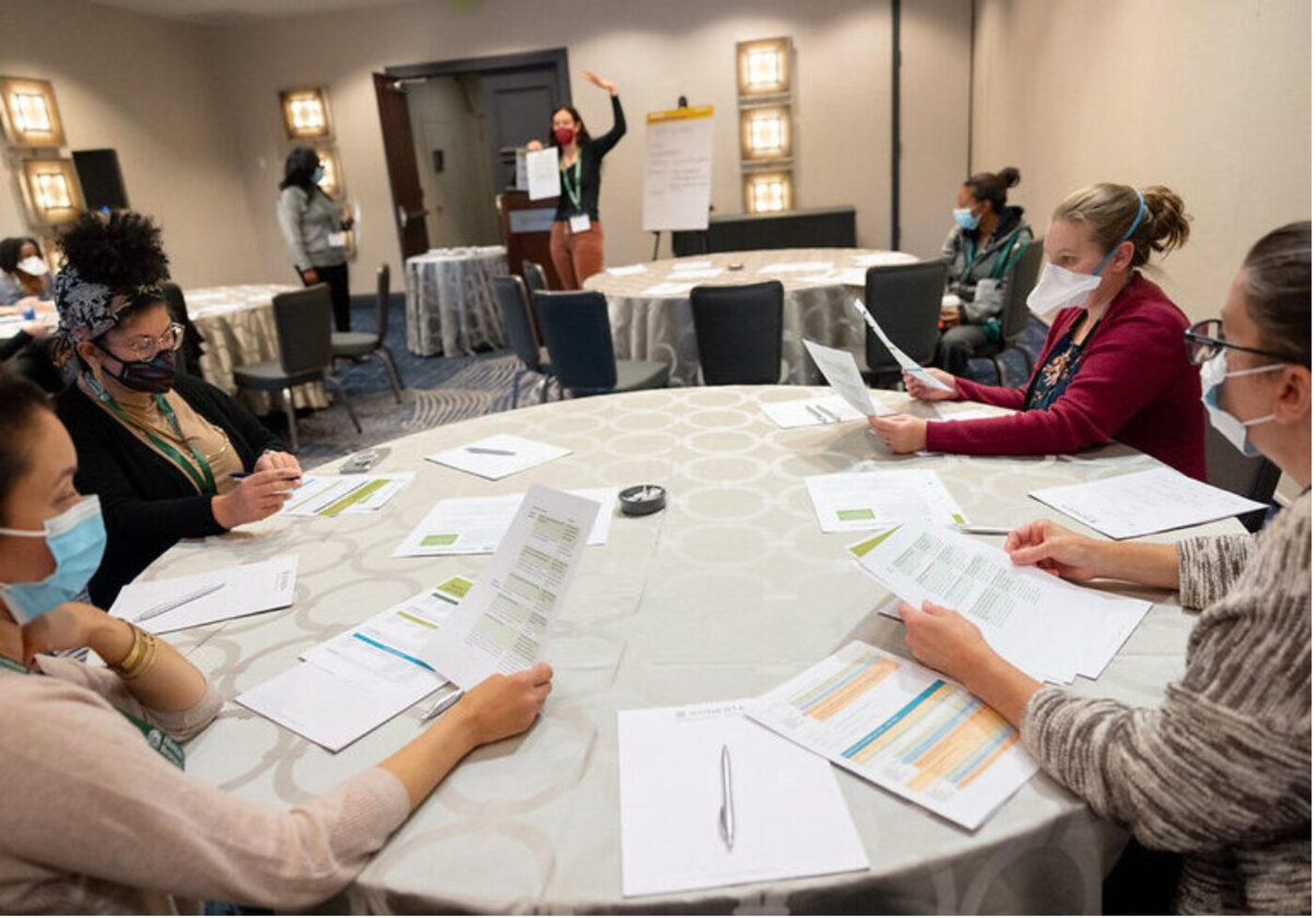 Parents and caregivers taking notes during a special education workshop.